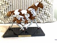 Left side view of pony figurine on base