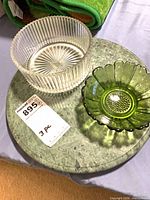 Top view of all three pieces showing marble board, clear ribbed bowl, green scalloped bowl with lot tag visible