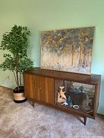 overall front view showing wood and glass sections, tapered legs