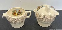 creamer and lidded sugar bowl front view