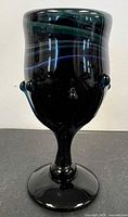 Full view of goblet front highlighting swirl pattern and prunts