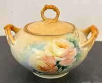 front view showing floral design and handles