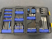 Overall view of open Kobalt case showing all remaining bits and empty slots