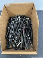 Box filled with numerous Allen wrenches