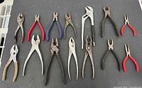 All 14 pliers and cutters laid out for full view