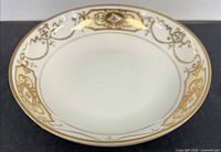 Top view showing gold-encrusted rim design and overall condition