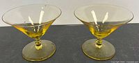 Both amber glasses side by side showing form and color