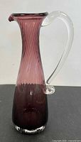 Full view of amethyst ribbed ewer jug with clear handle