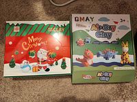 Front of both clay kit boxes