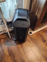 Front view of Cooler Master desktop tower on rolling stand