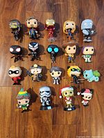 All 19 Funko Pop figures laid out on floor