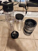 Ninja motor base, three tumblers, blade assembly arranged on floor