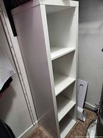 Front view of full shelving unit showing four compartments