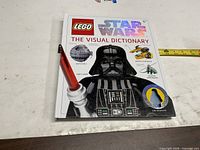 Front cover showing title, LEGO and Star Wars branding, Darth Vader image