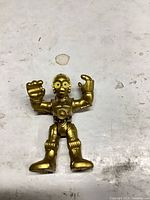 Full view of C-3PO gold action figure showing size and wear
