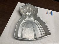 Top view of Barbie-shaped aluminum cake pan