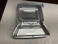Top view of entire aluminum pan showing computer shape and details