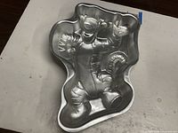Full view of aluminum Tigger cake pan showing character detailing