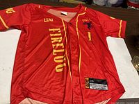 Front view showing button front, FIRELUG text, yellow trim, size tag