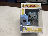 Front view of boxed Funko Pop Rocky #448 showing figure and packaging condition