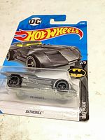 Front of blister card showing Batmobile die-cast car, DC Hot Wheels branding, series number 2/5.