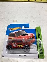 Front of sealed Hot Wheels Morris Mini on card showing car, series, scale, card number