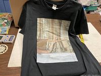 Front view of black Karol G Bichota Tour T-shirt with graphic