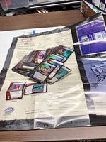Stack of Marvel Vs. System cards and rules sheet on table