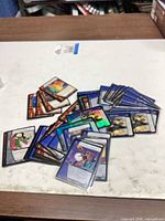 Mixed stack of Marvel Vs. System cards spread on tabletop