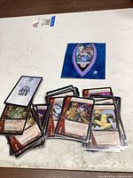 Stack of sleeved Marvel Vs. System cards and blue rule card on table