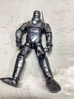 Front view of metallic silver armored action figure