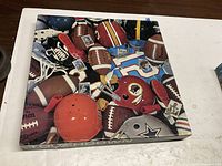 Top view of puzzle box showing football-themed image and title