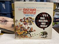 Front cover of gatefold album with title, artwork and credits