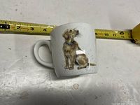Front view of mug showing puppy illustration and handle