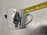 Front view of mug showing dog illustration and overall condition