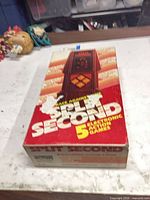 Box top showing Split Second branding and five game callout