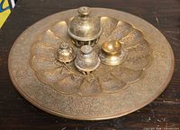 Top view of engraved brass tray with four containers