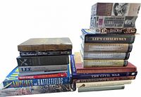 Overall view of two stacks of Civil War history books and two sealed video sets