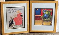 Both framed cat prints side by side