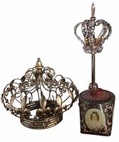 Two crown decor pieces and portrait tin grouped