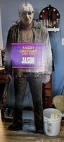 Front of life-size Jason standee with branding placard visible