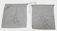 Front view of both ditty bags showing text and drawstrings