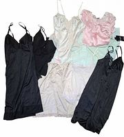 Group view of nine lingerie pieces laid out