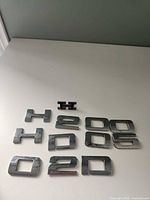 All 11 emblem pieces laid out on table