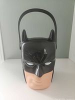 Front view of Batman head basket showing face and handle