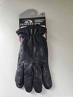Front view of gloves on retail card