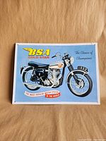 Front view of BSA Gold Star tin sign with motorcycle graphic