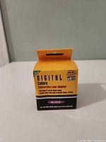 Front of yellow box reading DIGITAL Camera Conversion Lens Adapter, 58 mm specification visible