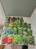 Overview of all 22 Burpee seed packets on tabletop