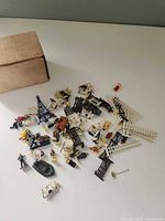 Full spill of assorted miniature accessories with box